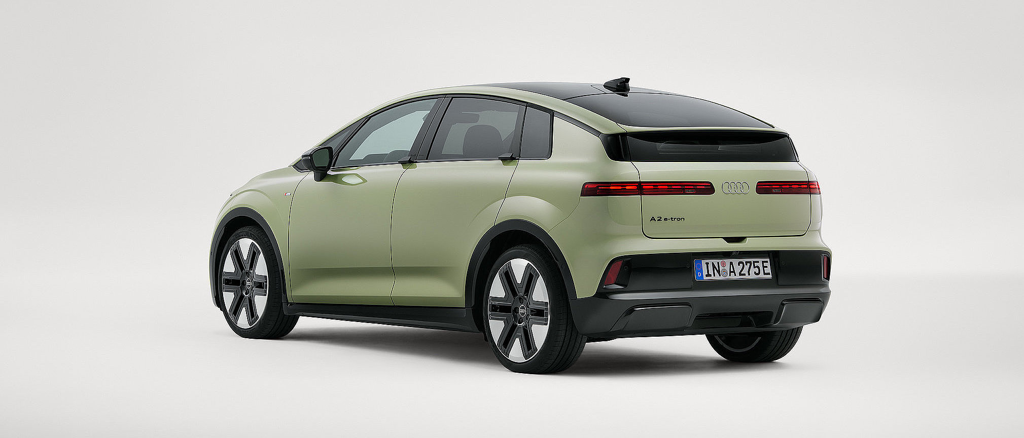 Audi A2 e-tron pistaziengrün Heckansicht schräg rechts Audi A2 e-tron pistaziengrün Heckansicht schräg rechts