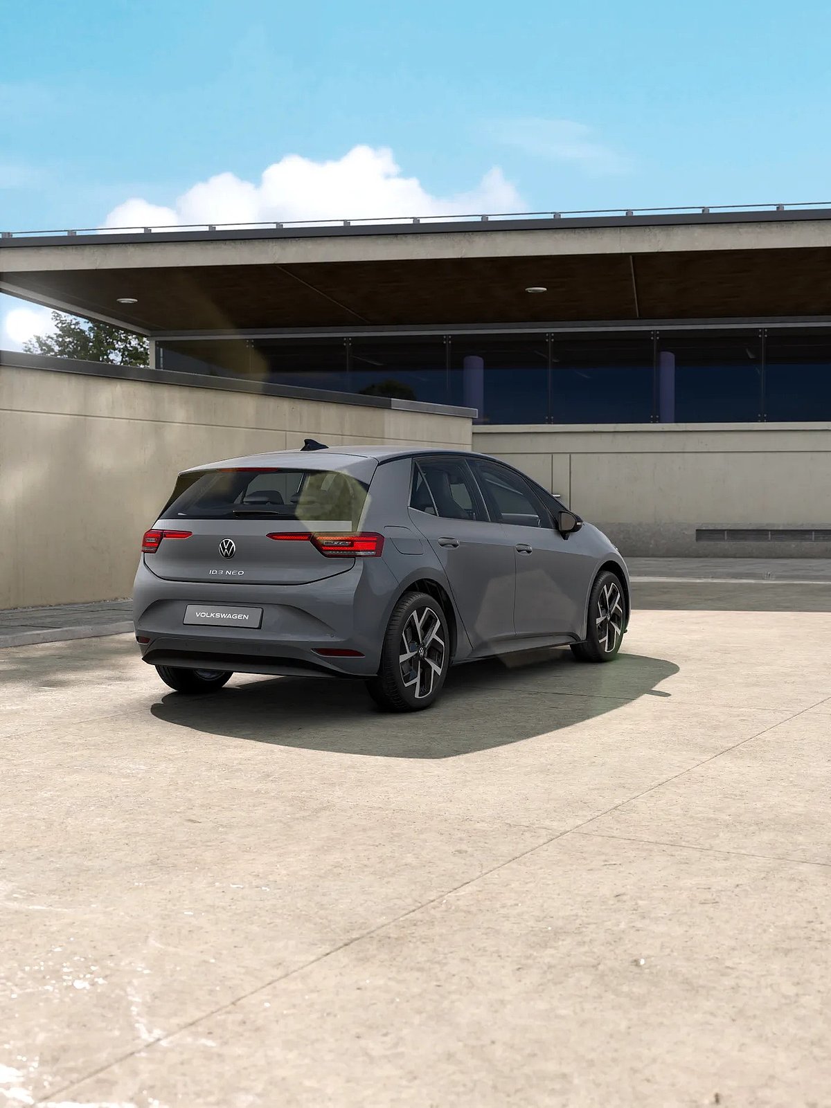 VW ID.3 Neo Style in Grau schräg von hinten vor moderner Architektur