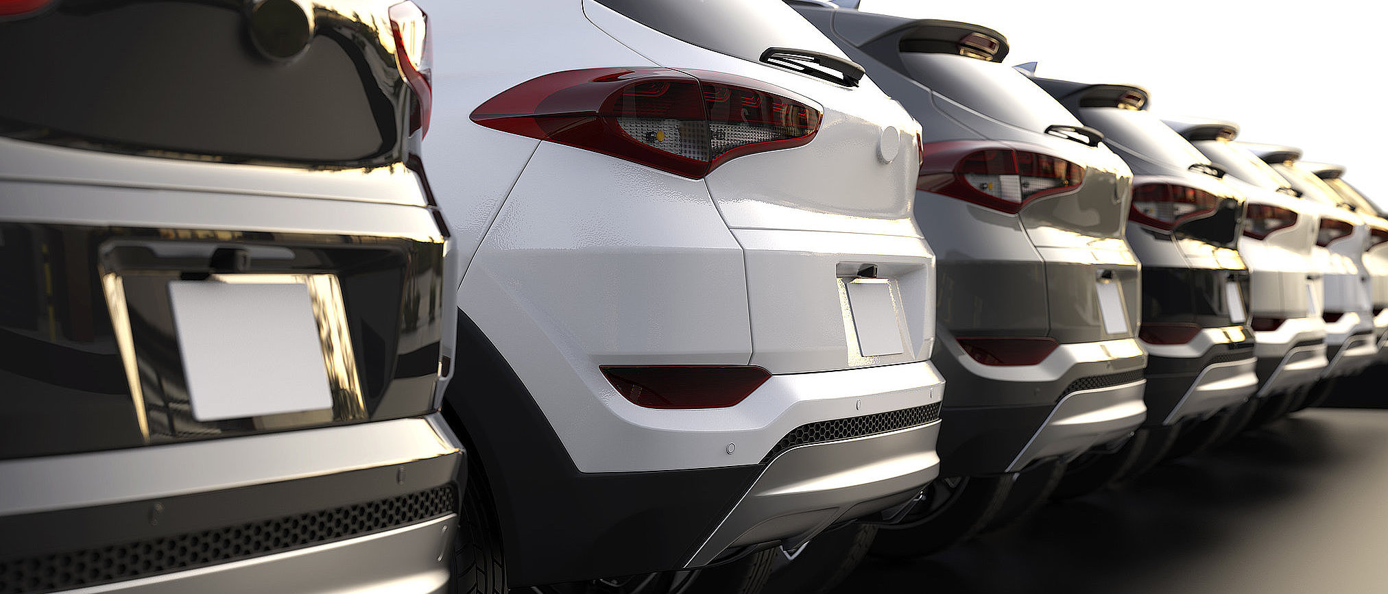 Fahrzeugflotte mit mehreren Autos als Symbol für eine Mietwagenanfrage bei Fischer Auto