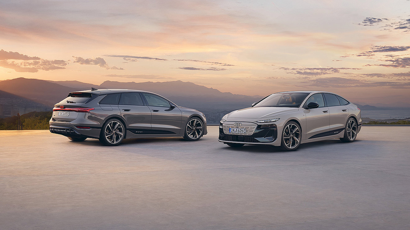Audi A6 e-tron Modelle als Limousine und Avant vor Bergkulisse im Sonnenuntergang
